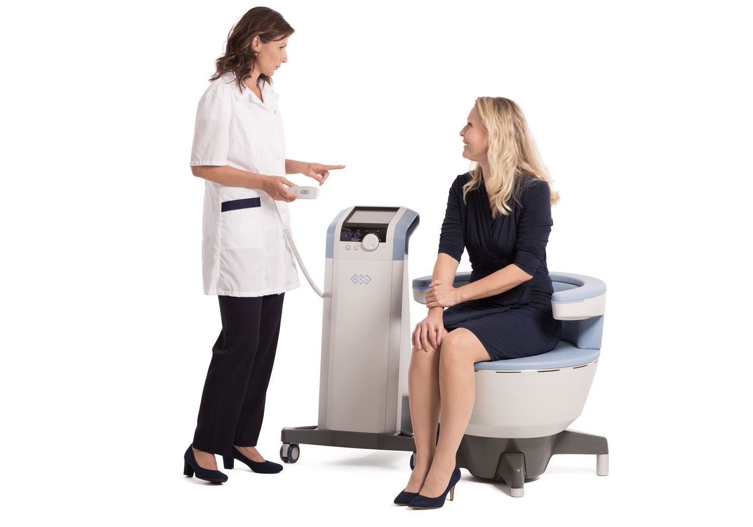 Woman Sitting in Emsella-Chair with Emsella Specialist Explaining to her about Incontinence Treatment.